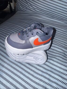 Nike Kids Grey Sneakers with Orange Swoosh